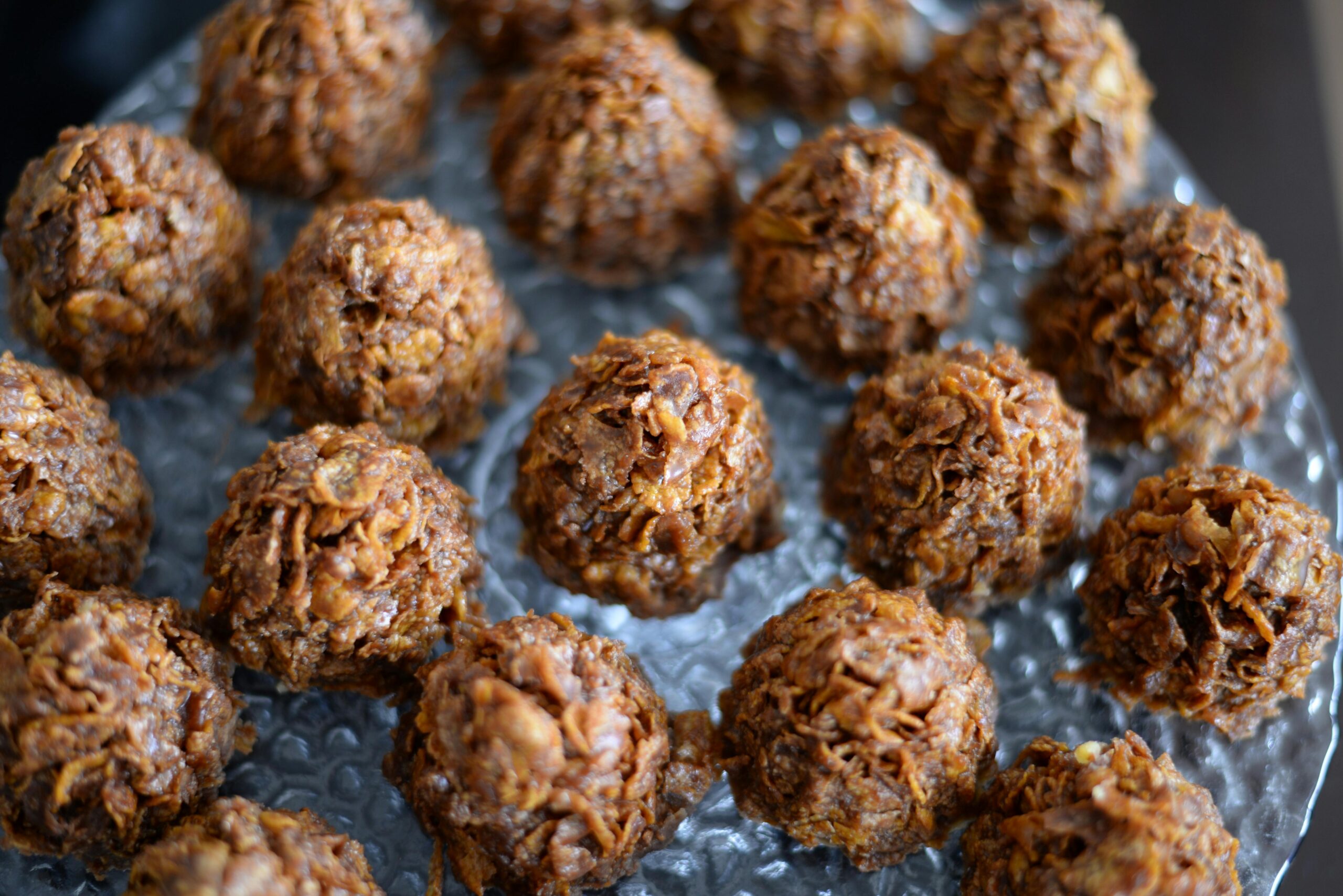 A healthy sugar free recipe that incorporates seed cycling for hormone balance: seed cycling ladoos