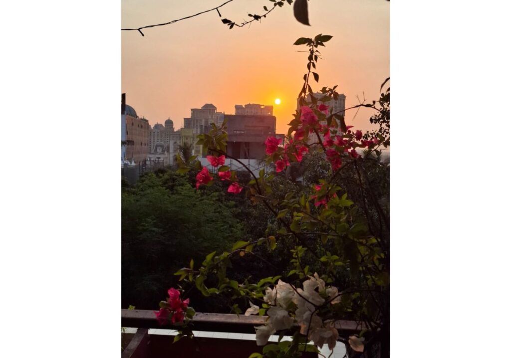 Sunset sky glowing in shades of orange and gold as the day comes to an end.